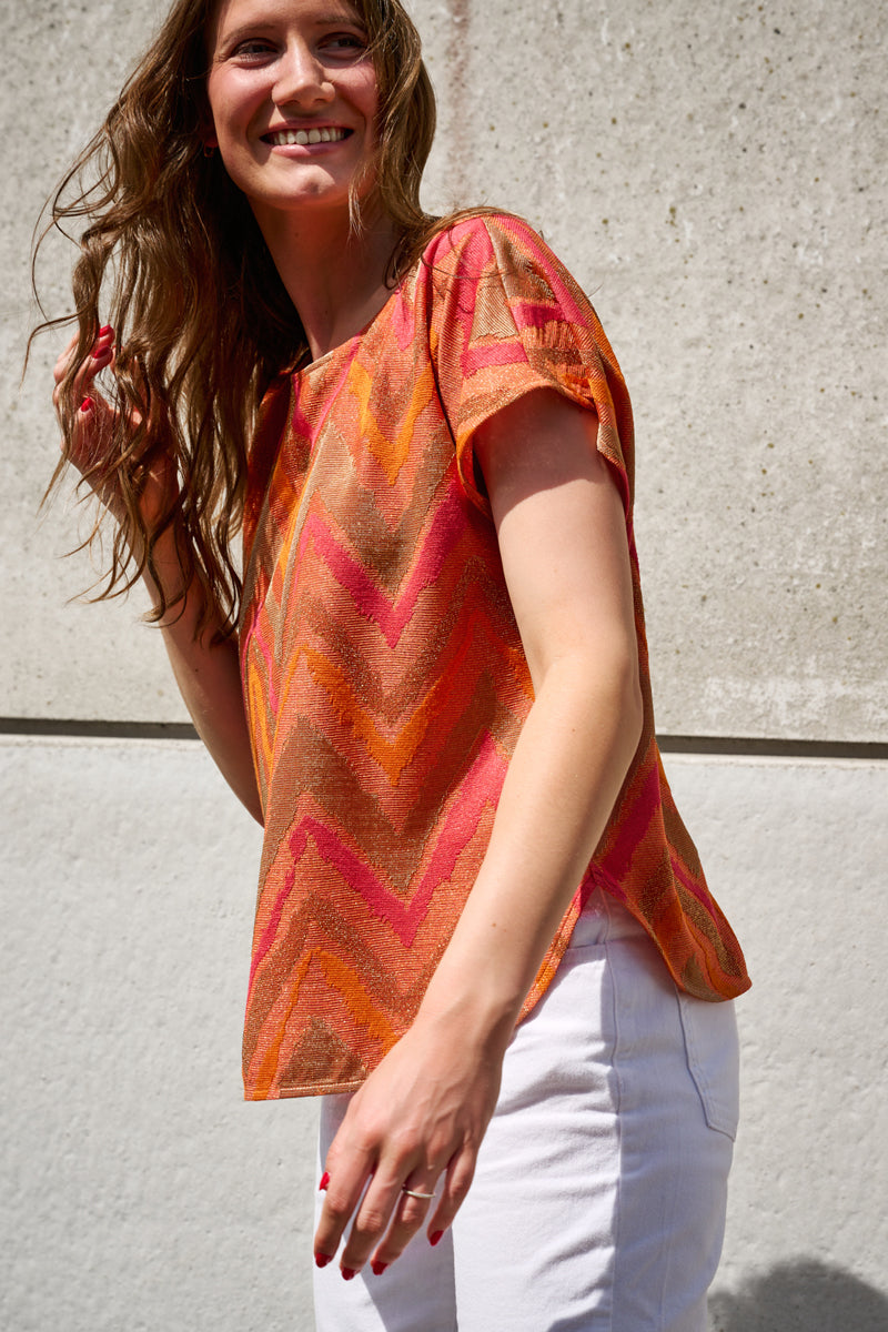 Tunic blouse with fuchsia and orange glitter print