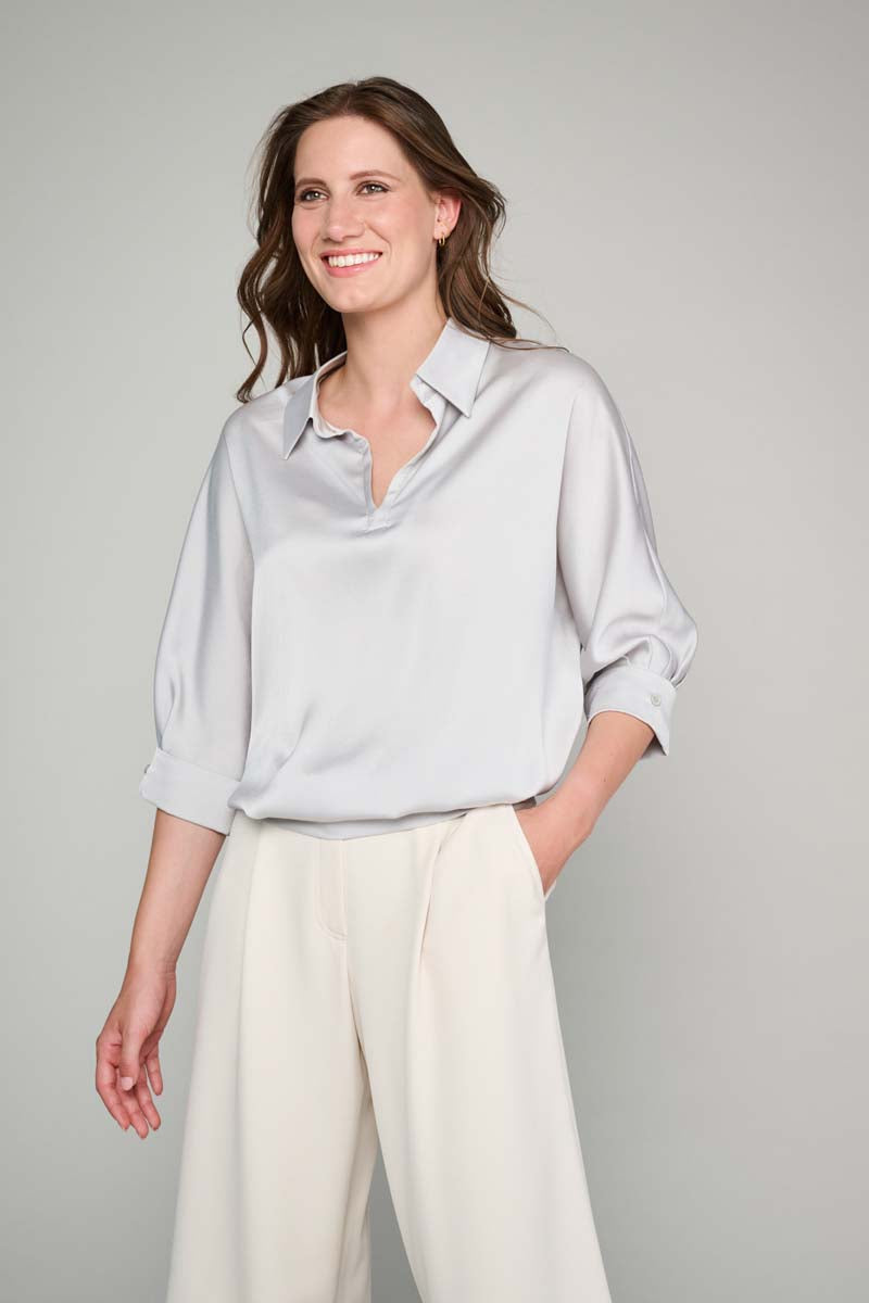 Light grey tunic blouse with half-length sleeves