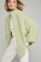 Olive green cape with snaps