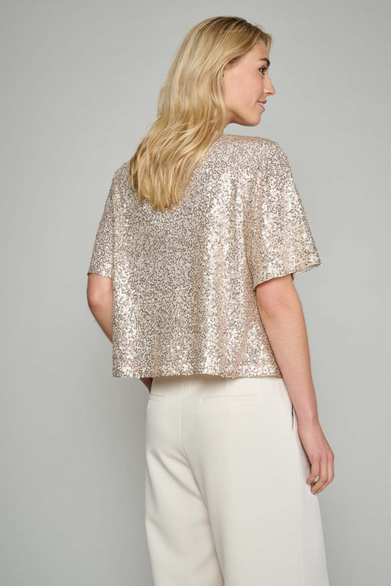 Golden festive top with sequins. 