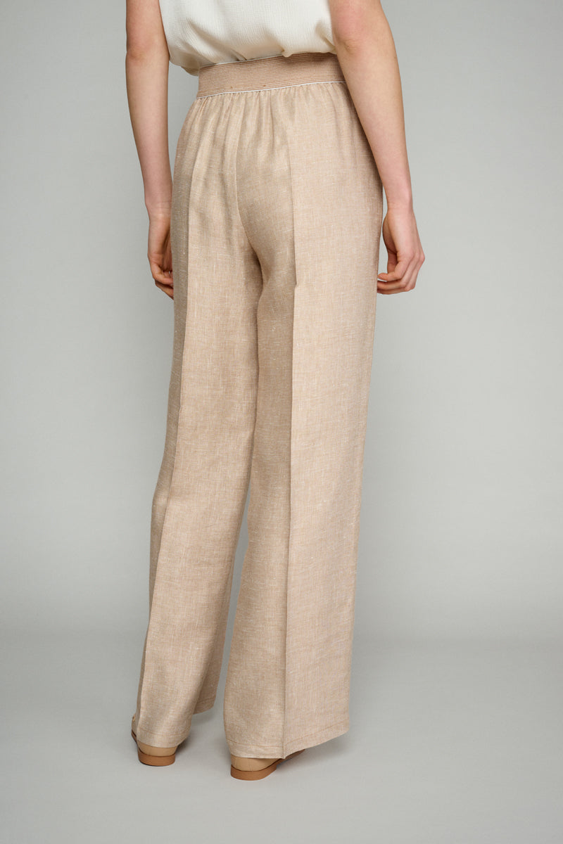 Wide trousers in beige pique fabric