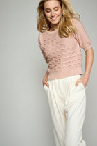 Textured knitted pullover in salmon pink