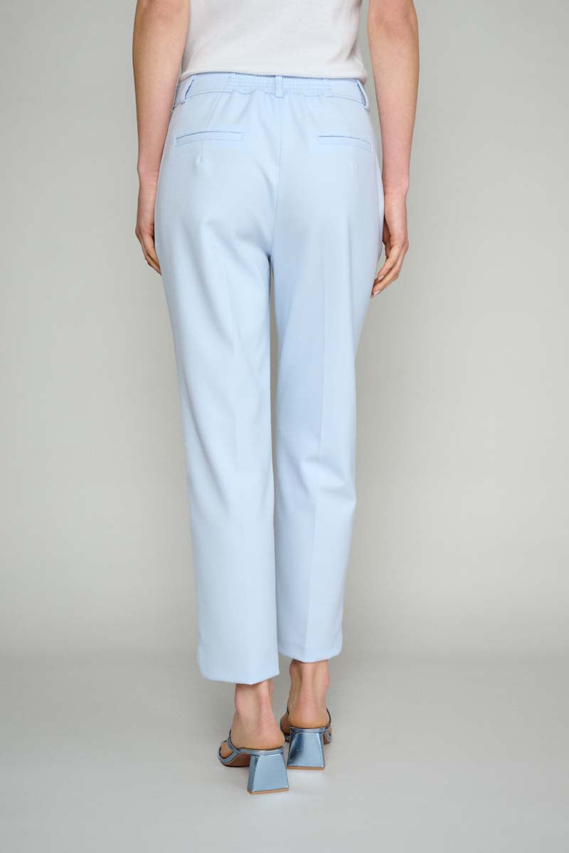 Smooth blue trousers with pleats