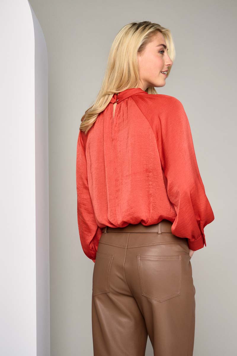 Trendy red blouse with detail