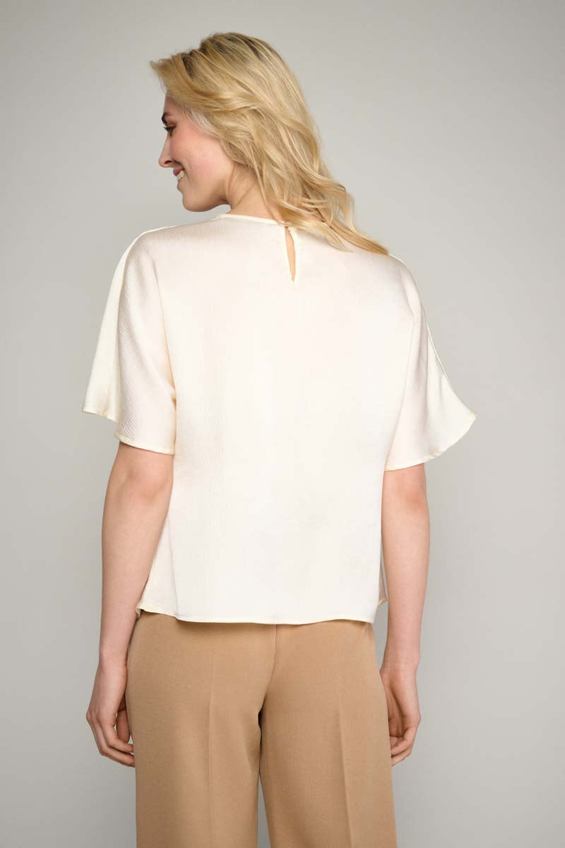 Cream top with waterfall neckline
