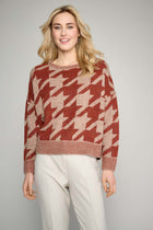 Rust colored sweater with abstract print