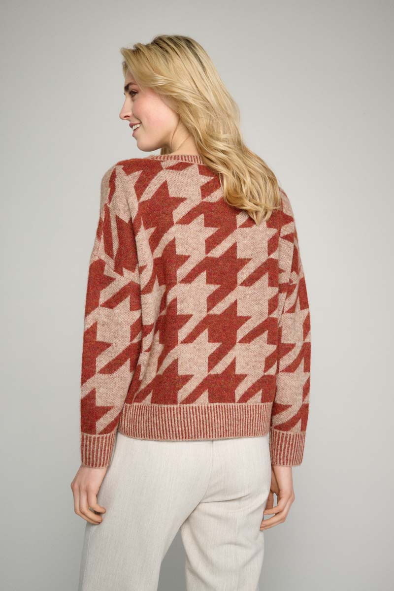 Rust colored sweater with abstract print