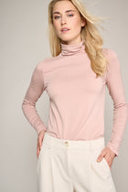 Soft pink turtleneck with details on the sleeves