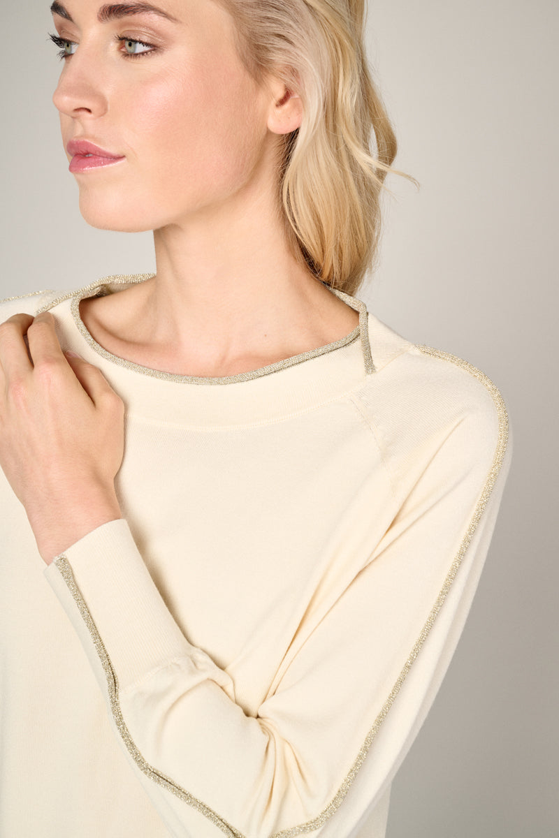 Cream colored pullover with long sleeves