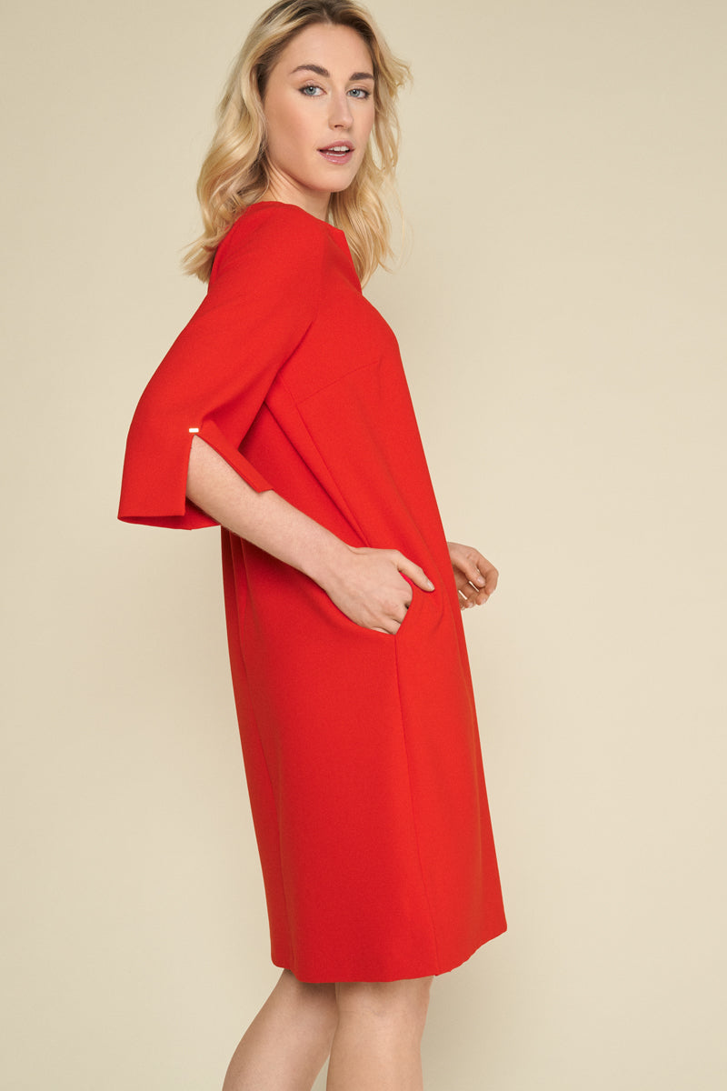 Elegant red dress with v-neck and beautifully finished sleeves