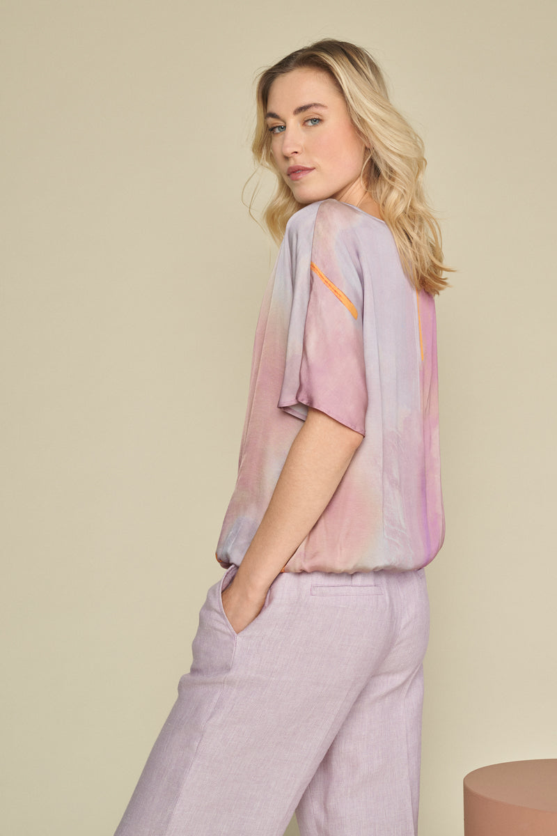 Short-sleeved blouse in shades of lilac, orange and pink