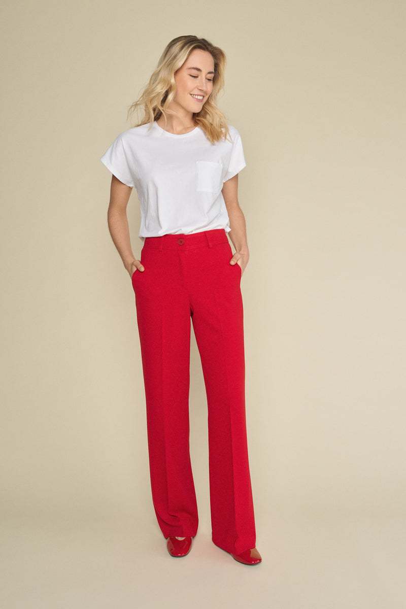 Red straight-leg trousers with subtle elastic at the back