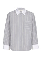 Blouse élégante à rayures bleues et écrues