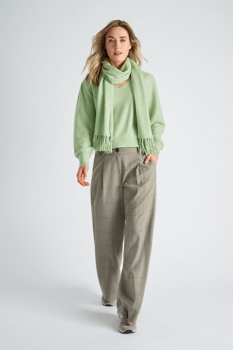 Pantalon ample vert avec plis en bande et motif à carreaux