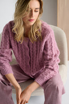 Pink cardigan with round neck and button closure