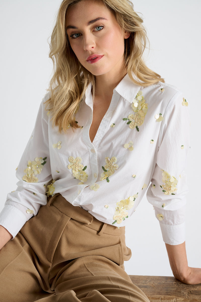 Chemisier blanc à paillettes jaunes