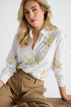 Chemisier blanc à paillettes jaunes