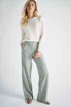 Light green trousers with elastic at the back of the waist