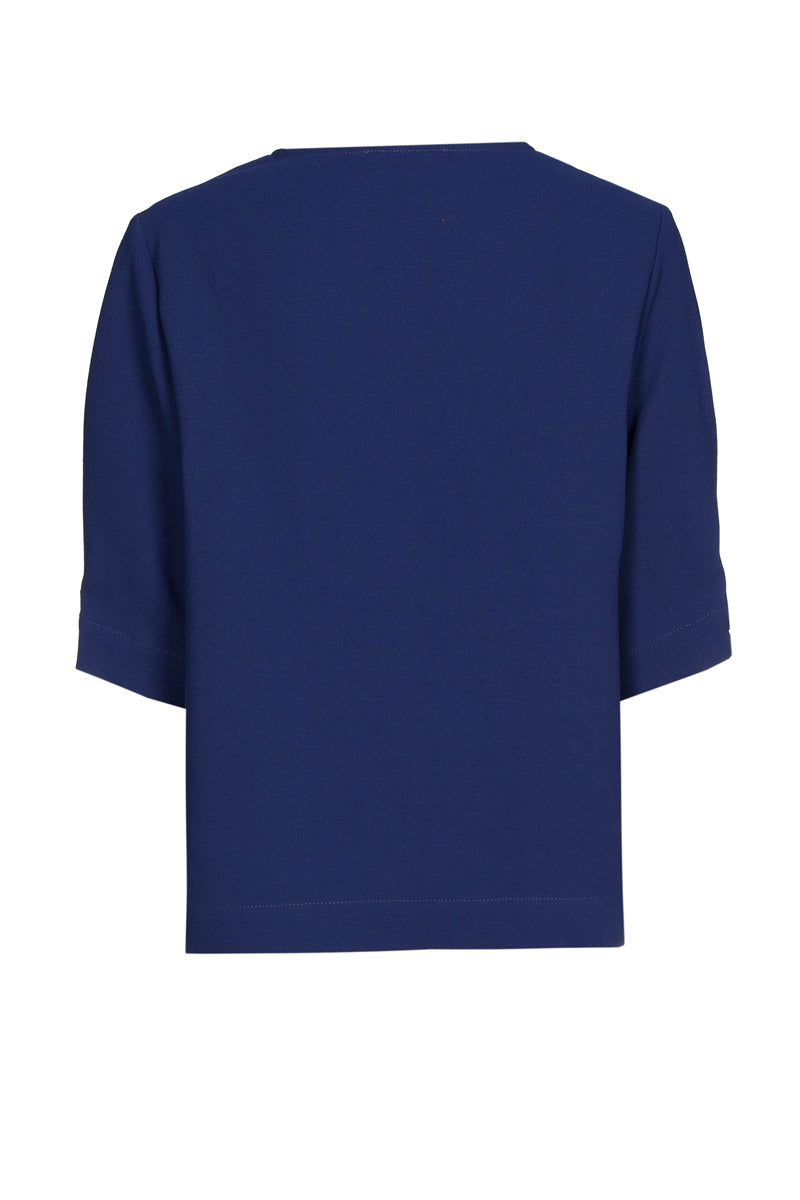 Chemisier bleu à col en V et manches joliment finies