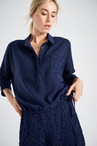 Navy blue blouse with lace breast pocket
