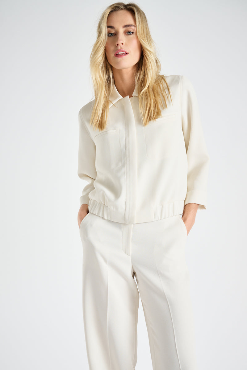 Short cream bomber jacket with collar and zipper