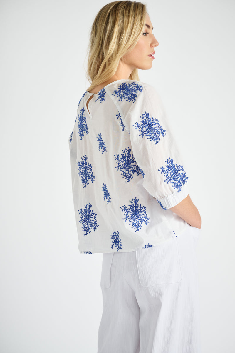 White shirt with embroidered flowers