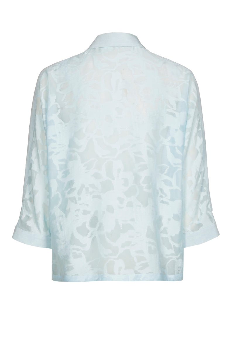Light blue polo shirt with transparent flowers