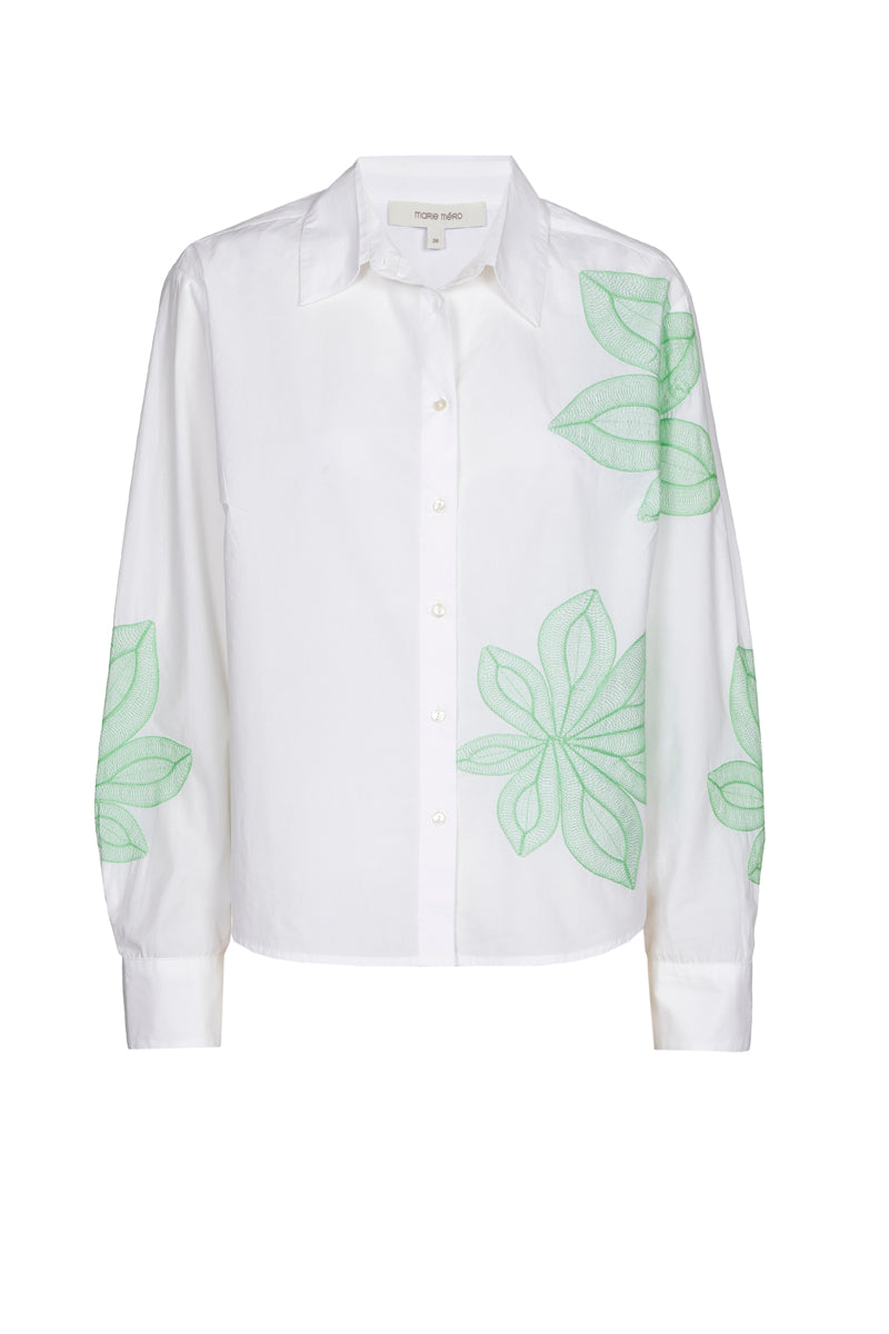 Witte bloes met groene bloem