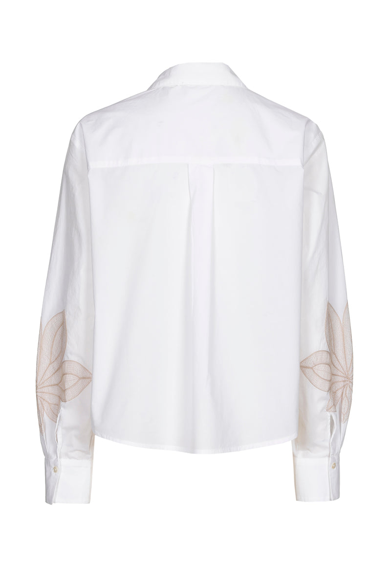 Blouse blanche à fleur beiges