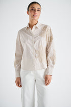 Gestreepte bloes met beige bloem