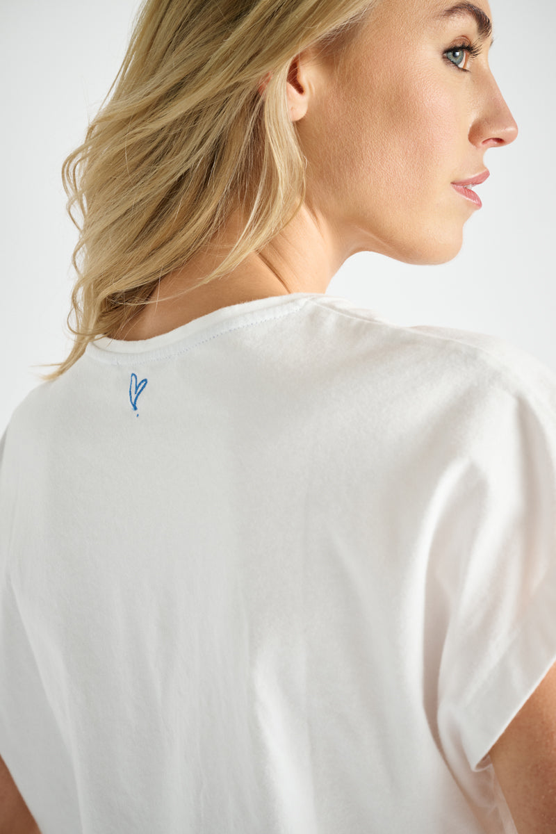 White t-shirt with blue embroidery
