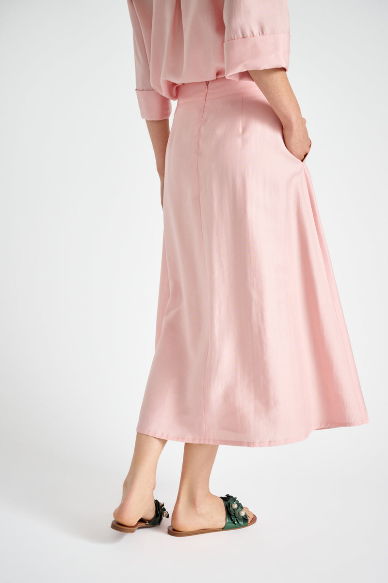 Wijde roze rok met bandplooien en zakken