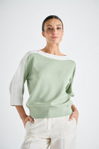 Bicolor sweater with mixed knit patterns