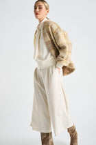 Cream culotte pants with pleats and pockets