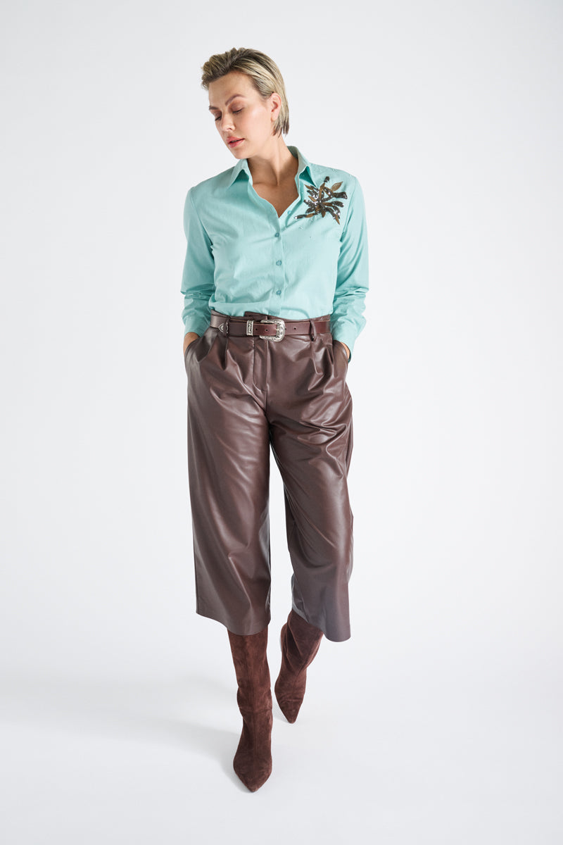 Turquoise bloes met paillettenbloem