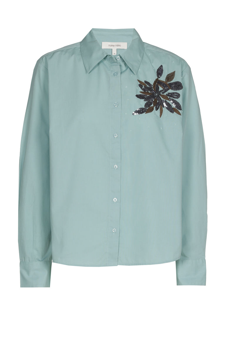 Turquoise bloes met paillettenbloem