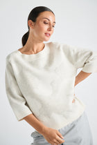 Wide cream sweater with jacquard pattern