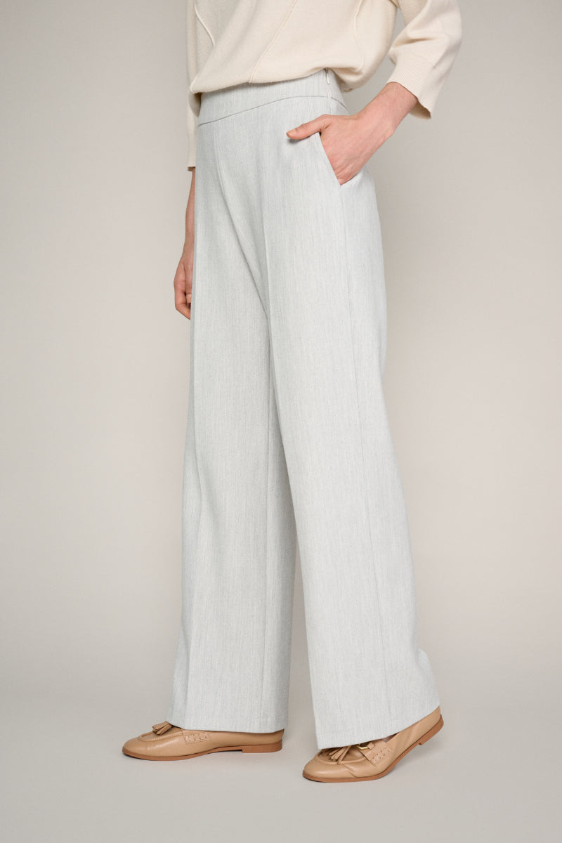 Wide grey trousers and elastic at the back of the waist