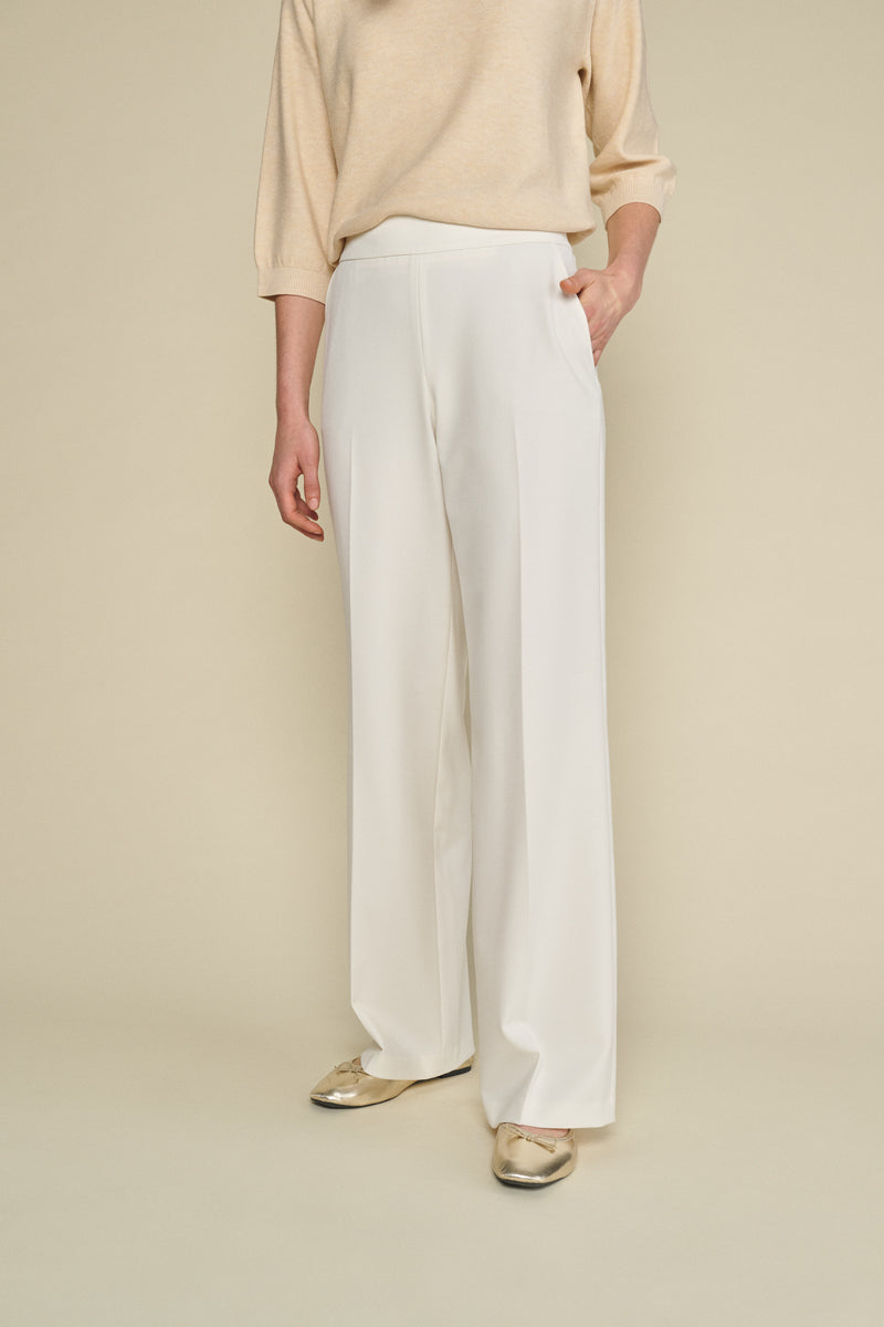 Cream wide-leg trousers with elastic at the back of the waist